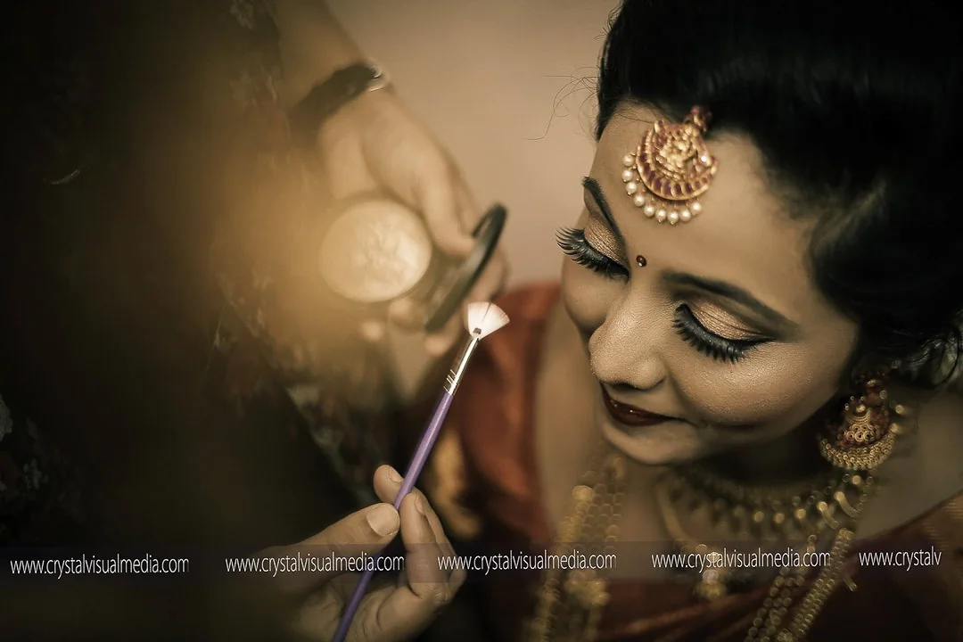 Bride during makeup photographed by Crystal Visual Media
